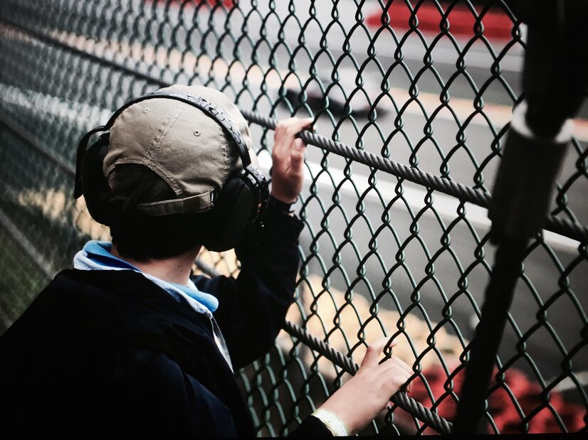 Man is watching out side from Barrier